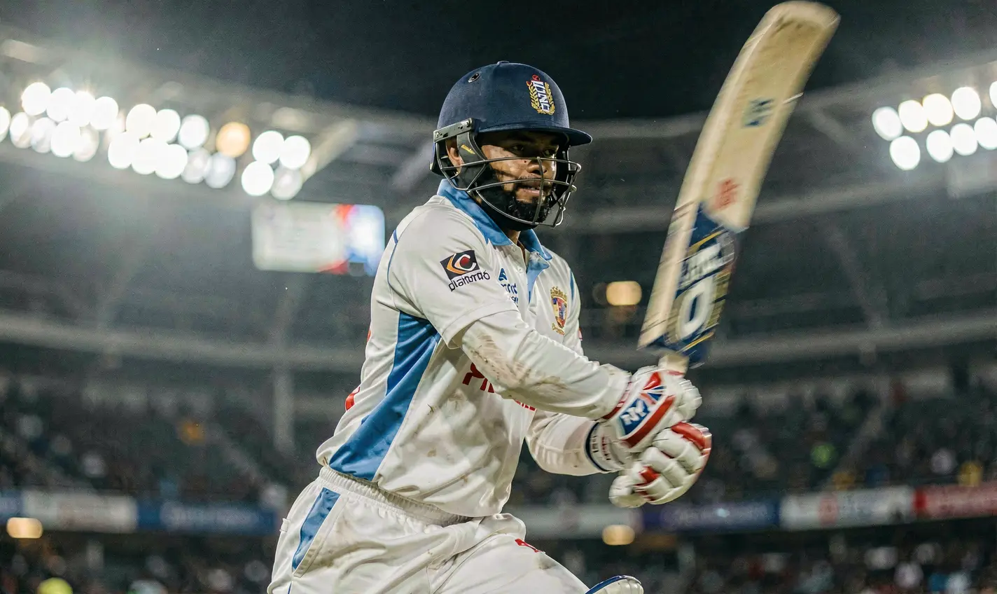 Dynamic cricket moment with a batsman playing a powerful stroke in a packed stadium capturing the thrill of live matches on 77KK Bet